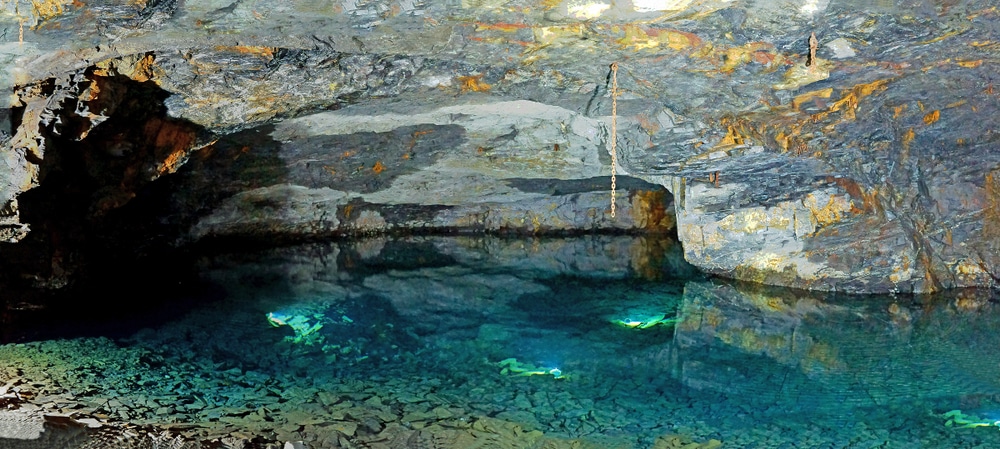 Blue water in Carnglaze Caverns in Cornwall