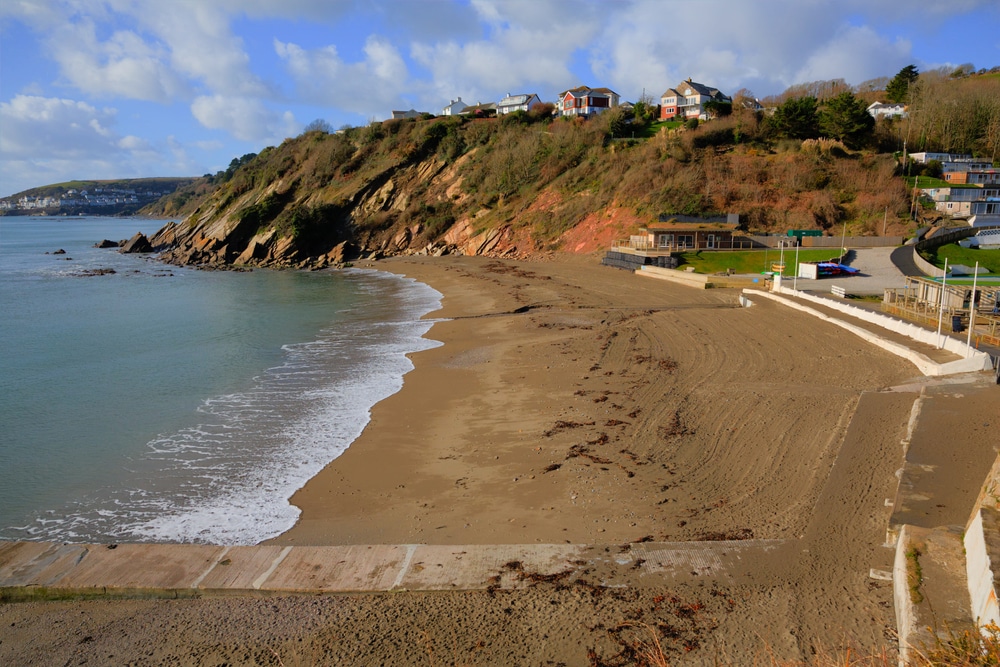 Golden sands of Millendreath Beach in Cornwall.